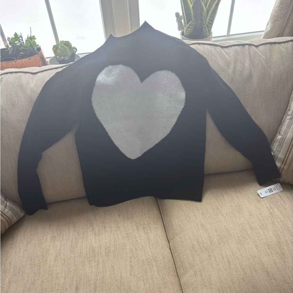 New black sweater with white heart